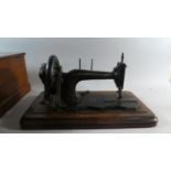 An Early Cased Sewing Machine by J Warwick, Manchester