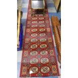 A Patterned Stair Carpet on Red Ground, 7.3m x 65cm