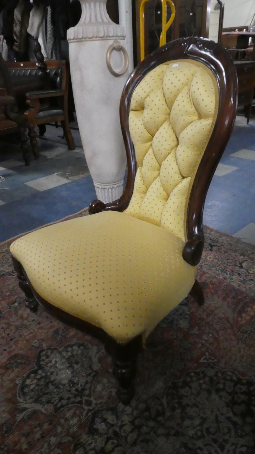 A Reupholstered Victorian Balloon Backed Ladies Nursing Chair with Serpentine Front