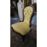 A Reupholstered Victorian Balloon Backed Ladies Nursing Chair with Serpentine Front