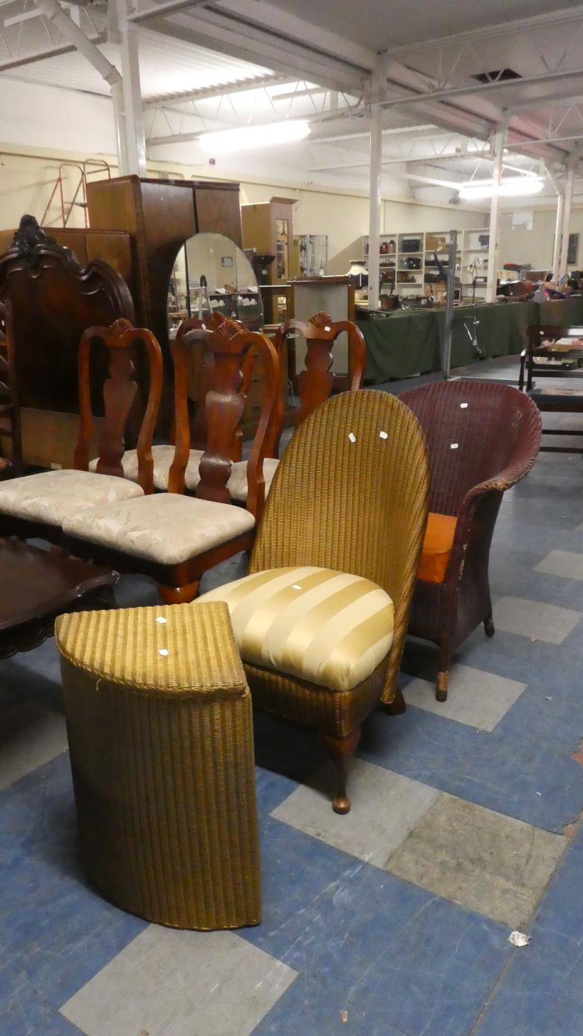 A Vintage Lloyd Loom Armchair, Lloyd Loom Nursing Chair and a Corner Linen Box