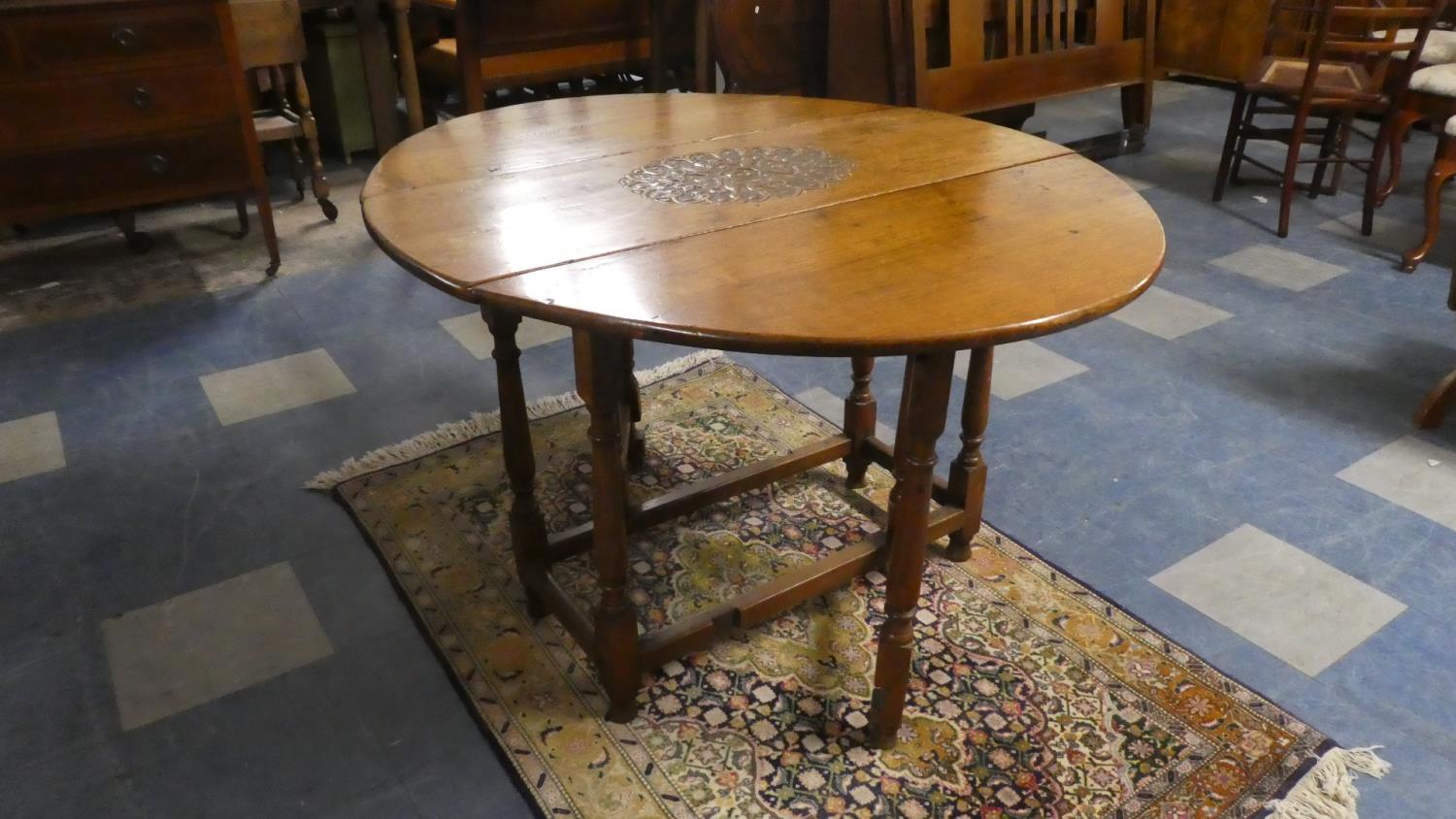 A 19th Century Oval Topped Gate Legged Dining Table with Later Carved Centre Panel, 100cm Wide