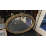 A Large Oval Gilt Framed Wall Mirror, 88cm Wide