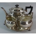 A Silver Plated Three Piece Tea Service on Tray with Three Claw and Ball Feet