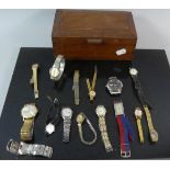 A Wooden Box Containing Various Ladies and Gents Wrist Watches