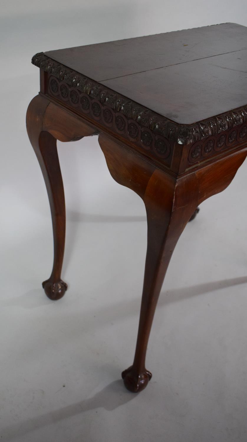 A Mahogany Silver Table with Carved Border set on Cabriole Legs culminating in Claw and Ball Feet, - Image 6 of 6