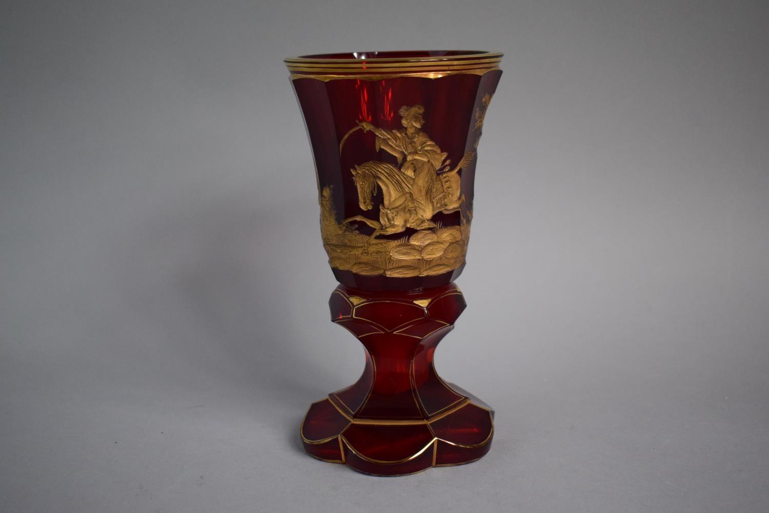 A Good Bohemian Gilt Overlaid Ruby Glass Goblet decorated with Mounted Turkish Soldier Riding Away