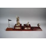 A Collection of Three Golfing Trophies and Golfing Pen Stand