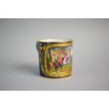 A Sevres Cobalt Blue and Gilt Coffee Can with Hand Painted Cartouches depicting Royal Hunting