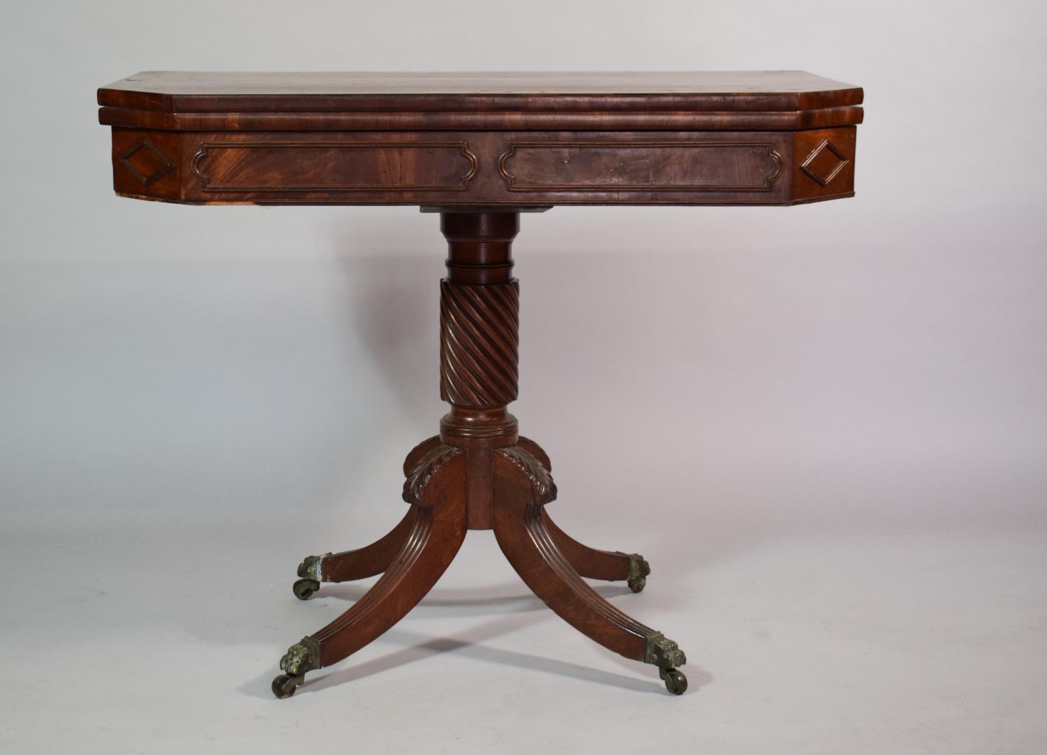 A 19th Century Mahogany Tea Table set on Spiralled Support with Brass Claw Casters. 92x45x74cms when