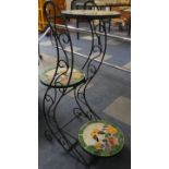 A Wrought Iron Three Tier Plant Pot Holder with Mosaic Stands. 79cms High