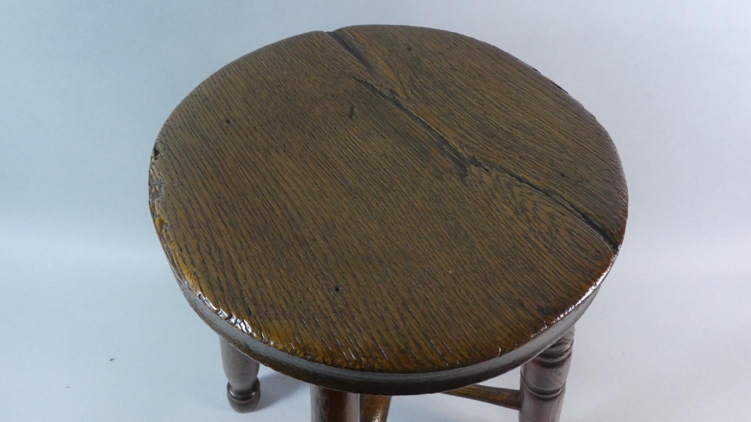 A 19th Century Ash and Beech Factory Stool with Solid Seat Over Turned Legs and Stretchers. 46cm - Image 2 of 3