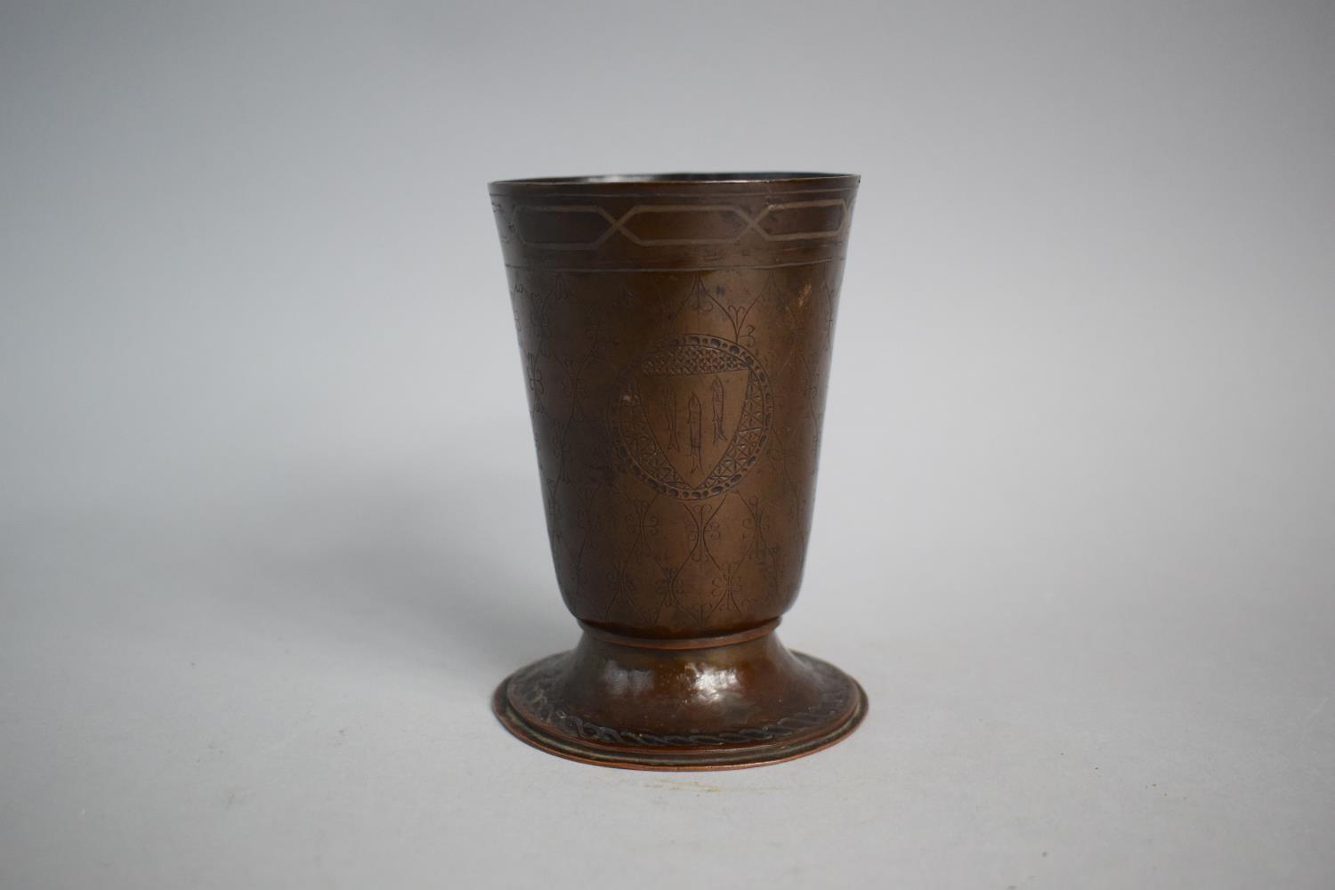 A Hand Beaten Copper Goblet with Etched Decoration and Three Armorial Cartouches