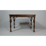 A Reproduction Mahogany Occasional Table with Unusual Tri-Spindle Supports