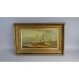 A 19th Century Gilt Framed Oil on Board depicting Fisherman and Family with Barge on Beach