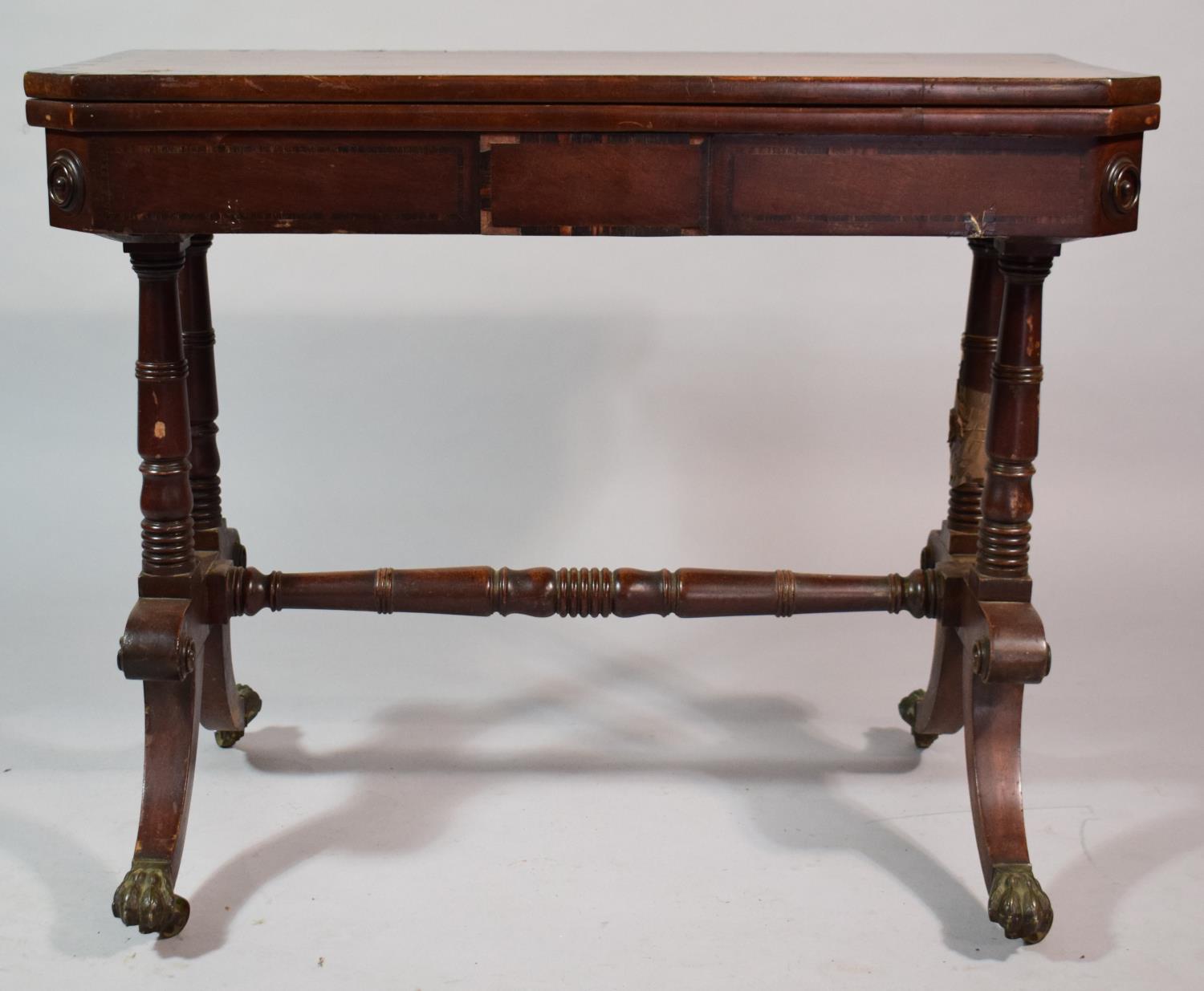 A Mid/Late 19th Century Mahogany Lift and Twist Games Table with Claw Feet and Castors. 89cms Wide