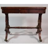 A Mid/Late 19th Century Mahogany Lift and Twist Games Table with Claw Feet and Castors. 89cms Wide