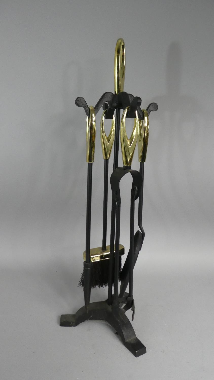 A Modern Brass Mounted Iron Fireside Companion Set, 61cm high