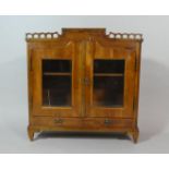 A 19th Century French Cherrywood Table Top Bookcase, with a Pierced Frieze Over Two Glazed Doors and