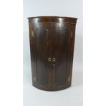 A 19th Century Bow Fronted Mahogany Wall Hanging Corner Cabinet. 66cms