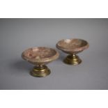 A Pair of Continental Circular Marble Salts on Silver Turned Socles. 9.75cms Diameter