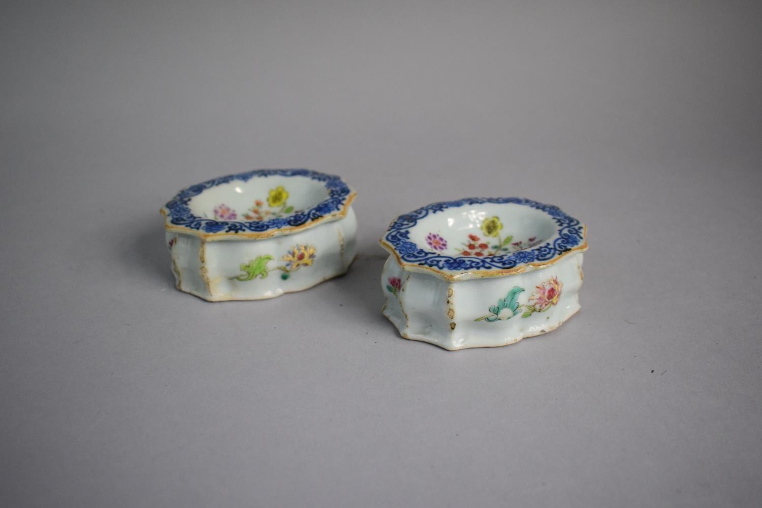 A Pair of Early Chinese Glazed Stoneware Salts decorated with Flowers and Blue and White Border.