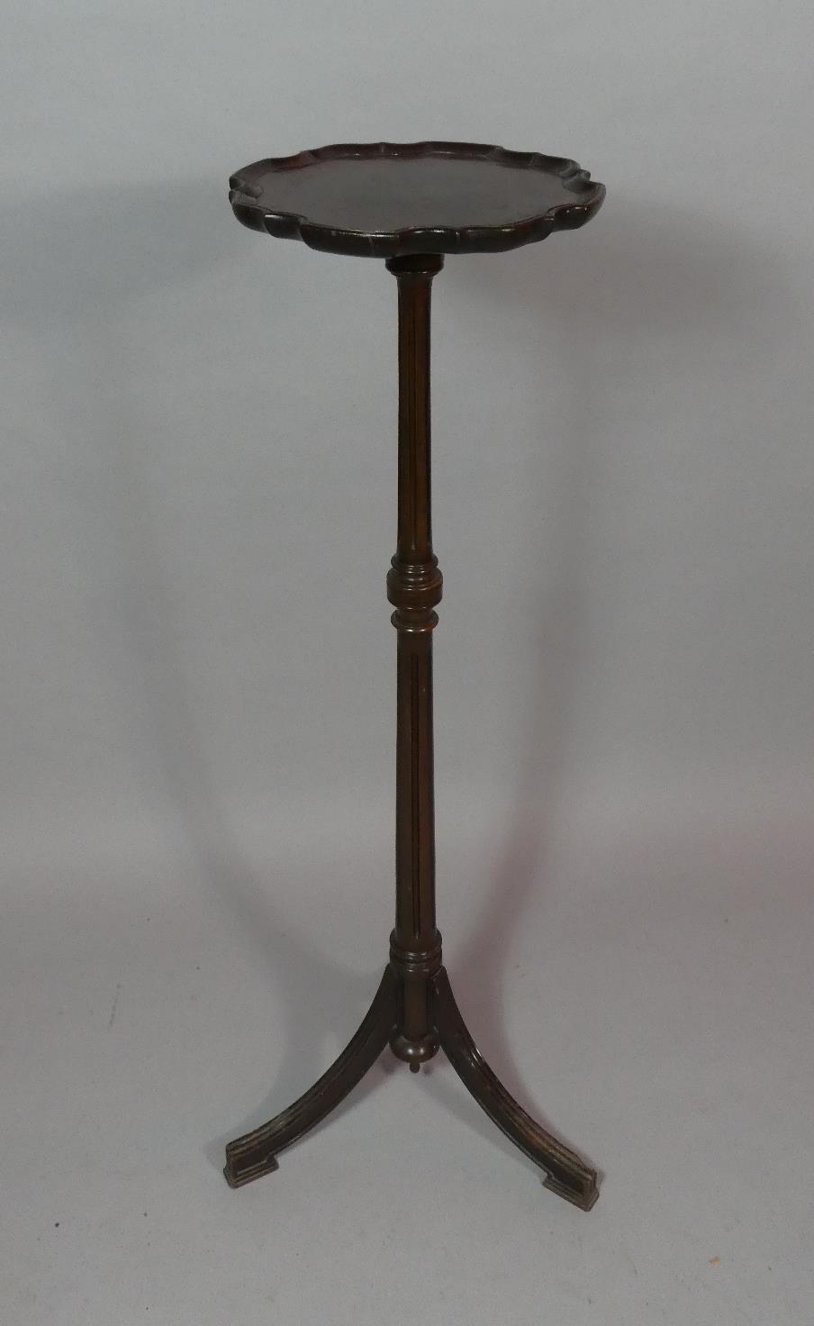 A Mahogany Candle Stand or Torchere with Turned Reeded Support on Tripod Base. 107cms High