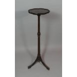 A Mahogany Candle Stand or Torchere with Turned Reeded Support on Tripod Base. 107cms High