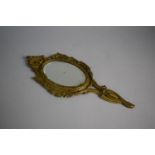 A Late 19th Century Bronze Framed Dressing Table Hand Mirror with Bevelled Glass. 30cms Long