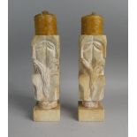 A Pair of Modern Carved Stone Candlesticks each with Four Side Masks, 24cm High