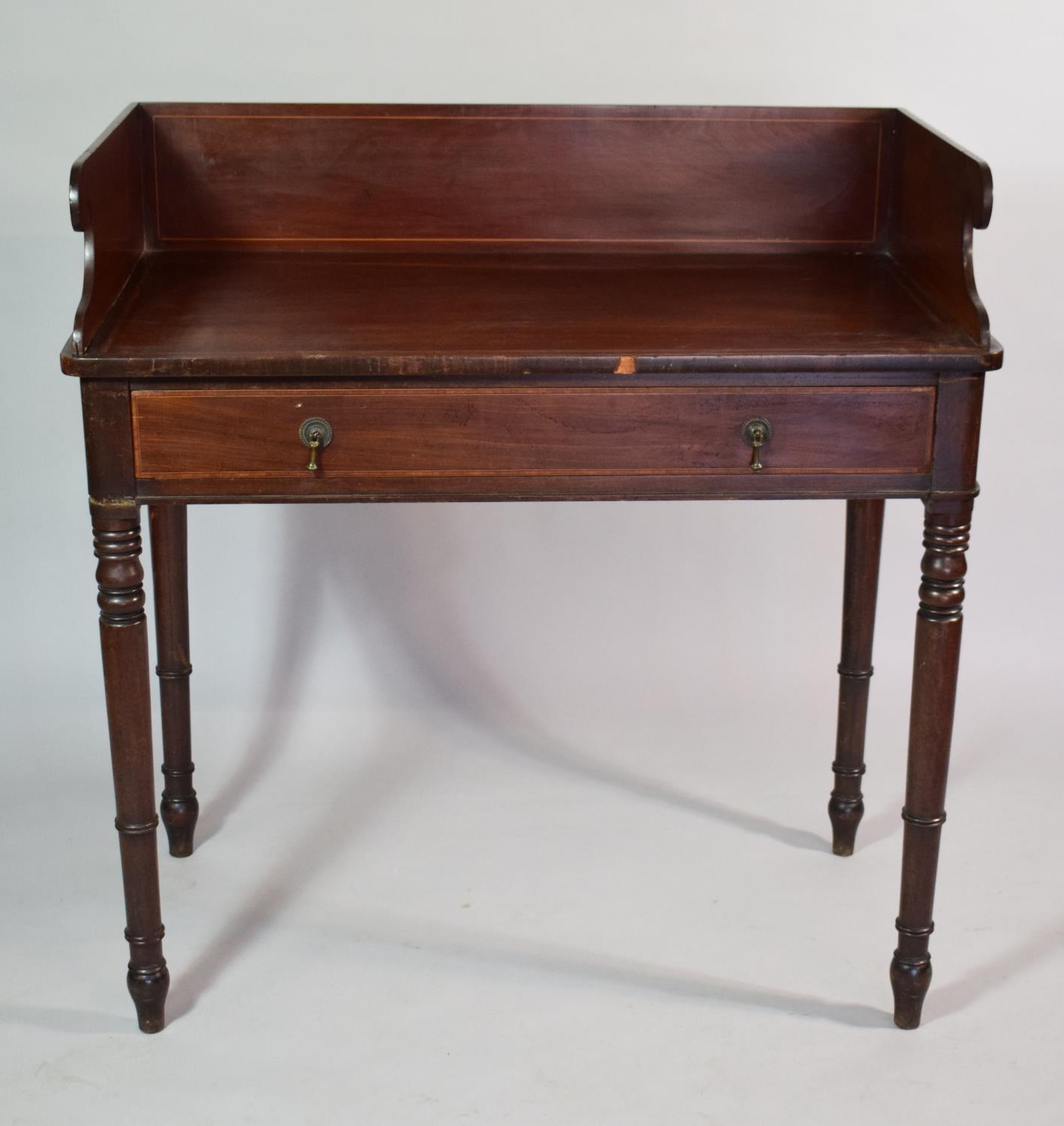 A 19th Century Mahogany Washstand with Carved Raised Gallery and Set on Turned Wooden Legs having