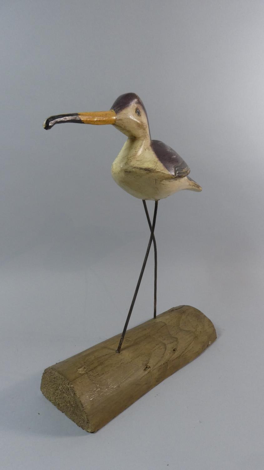 A Mid 20th Century Painted Wooden Folk Art Shore Bird Mounted on a Driftwood Base. 39cm High