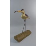 A Mid 20th Century Painted Wooden Folk Art Shore Bird Mounted on a Driftwood Base. 39cm High