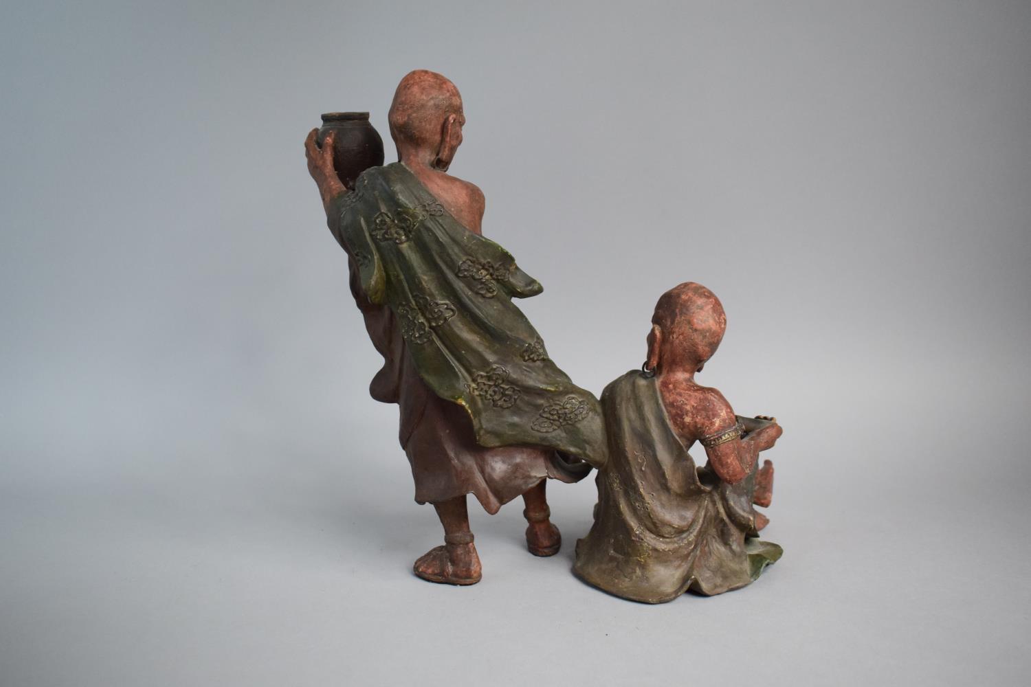 A Japanese Terracotta Figure Group, Monk Teasing Seated Scribe. 30.5cms High - Image 3 of 3