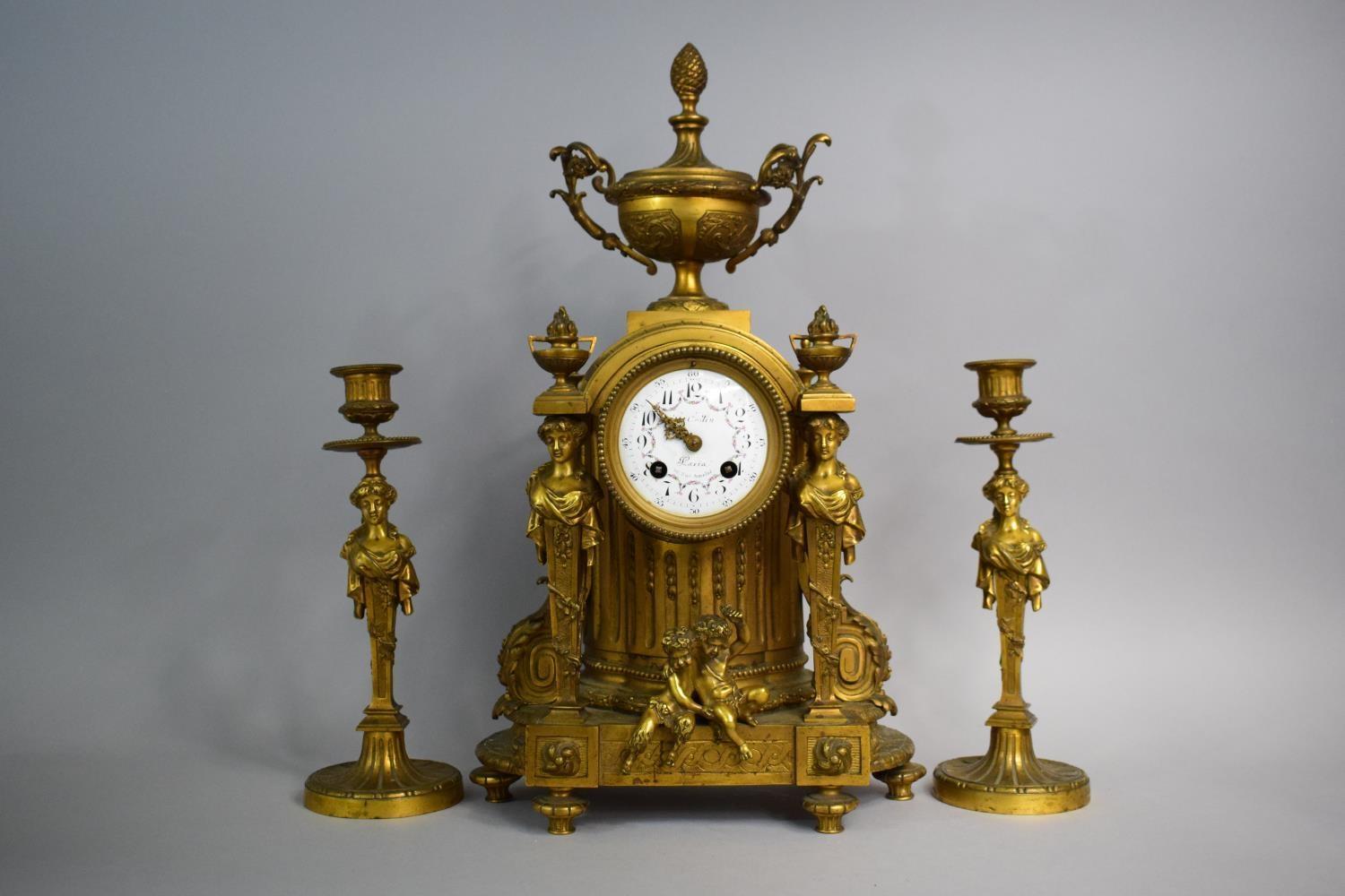 A French Gilt Bronze Clock Garniture in the Second Empire Style having Maiden Supports, Cherub