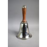 An Ornamental Silver Plated Hand Bell with Wooden Handle, 27cms High