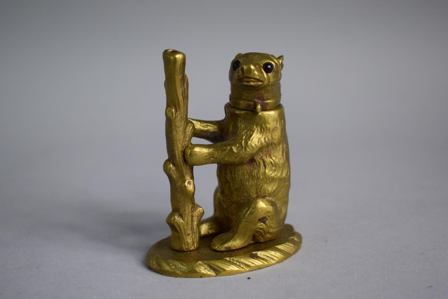 A Late 19th Century/Early 20th Novelty Night Light in the Form of a Bear with Hinged Head. 7.5cm