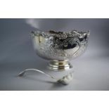 A Large Silver Plated Punch Bowl with Hand Chased Repousse Decoration and Circular Foot. 36cms