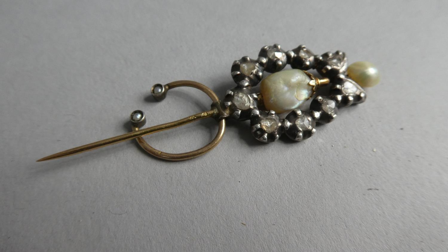 A Late Georgian/Early Victorian Gold Metal, Baroque Pearl and Diamond Mounted Pin. 9 Rough Cut