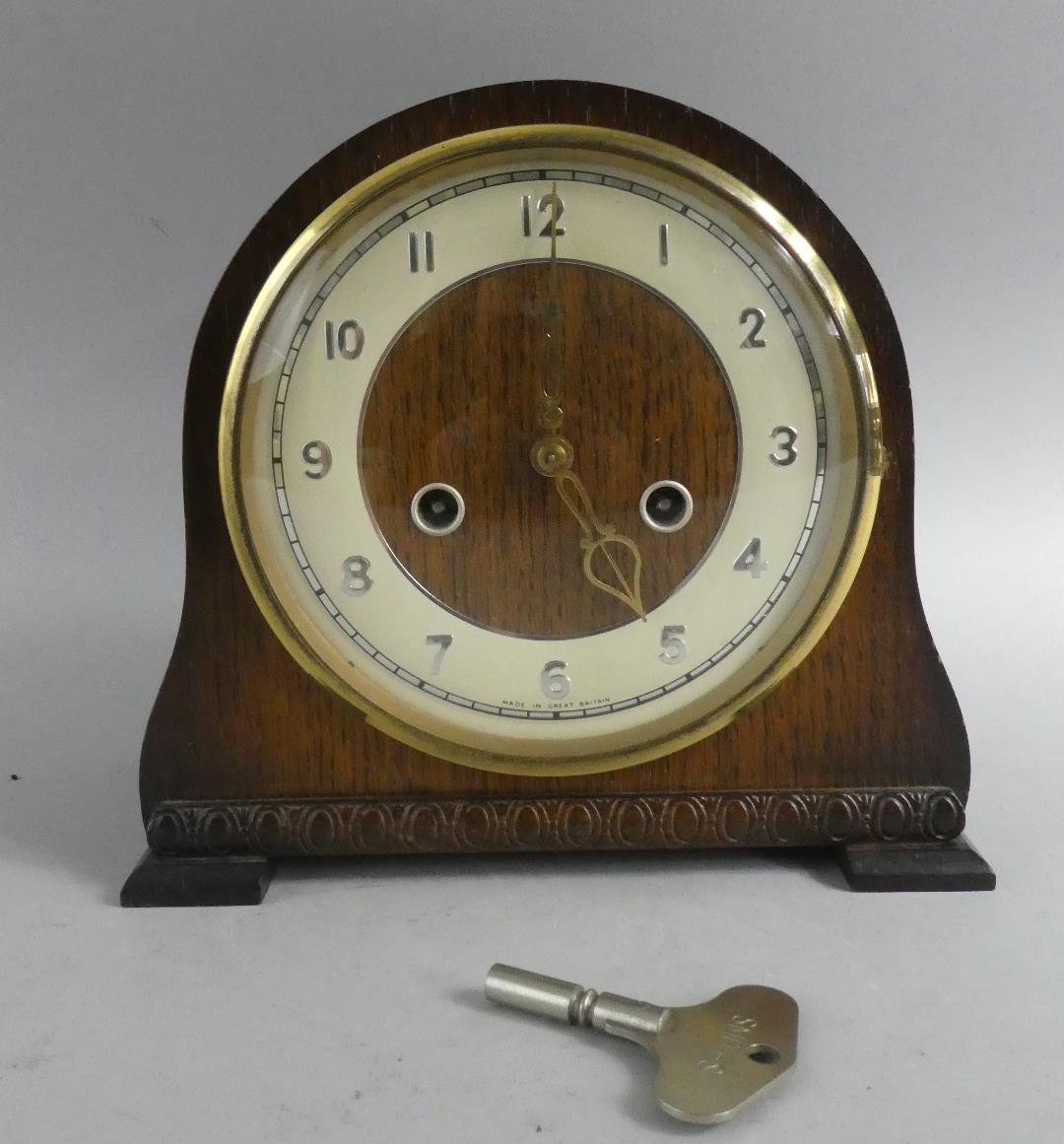 An Oak Cased Mantel Clock 22cms Wide