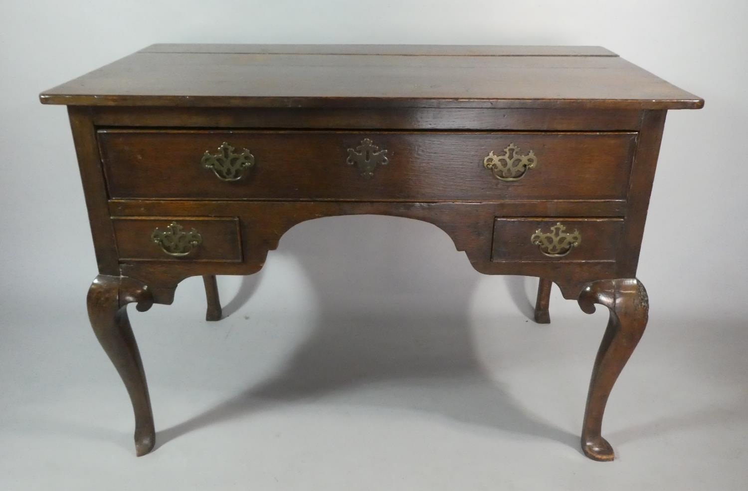 A George II Oak Lowboy on Cabriole Legs with Top Long Drawer Over Two Short Drawers, 106cm Wide