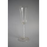 A Double Air Twist Wine Glass with Unground Pontil and Folded Foot. 20.25cms High