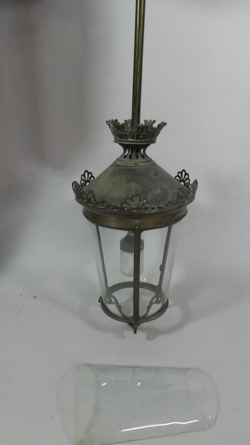 A Vintage Gothic Style Brass Hall Ceiling Lantern with Pierced Castellated Decoration, 115cm High
