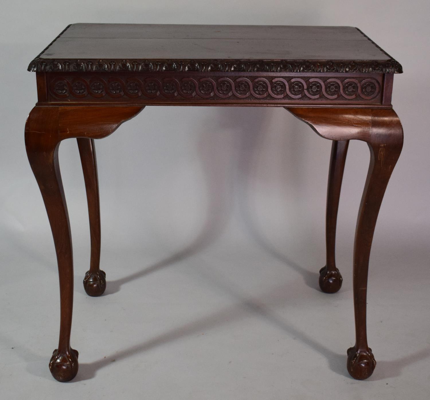 A Mahogany Silver Table with Carved Border set on Cabriole Legs culminating in Claw and Ball Feet, - Image 2 of 6