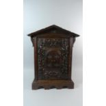 A 19th Century Black Forest Carved Linden Wood Table Cabinet. 40cm x 19cm x 59cm High