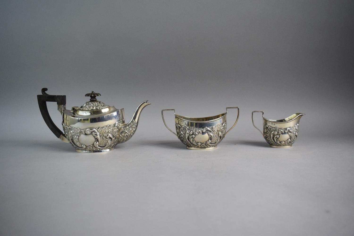 A Silver Three Piece Bachelor's Tea Service with Repousse Decoration, Birmingham 1900 - Image 3 of 3