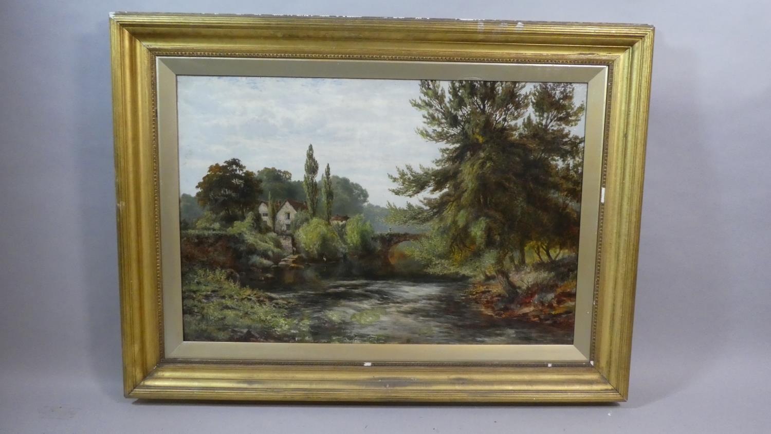 Albert E. Gyngell 1866-1949. A Gilt Framed Oil on Canvas Depicting River Scene with Cottage and