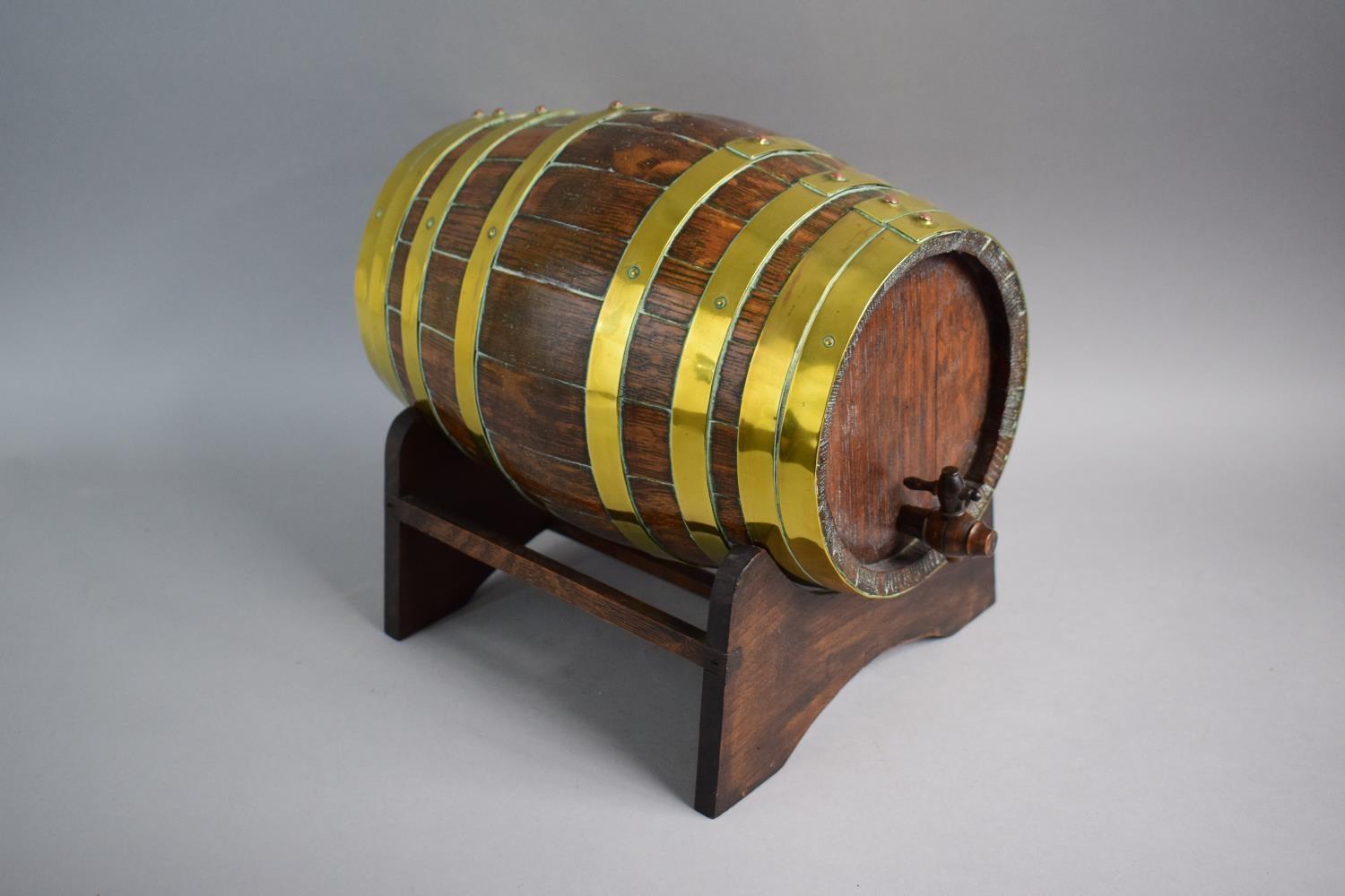 A Late 19th Century Brass Banded Oak Spirit Barrel on Stand. 28.5cms Long. Complete with Tap