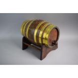 A Late 19th Century Brass Banded Oak Spirit Barrel on Stand. 28.5cms Long. Complete with Tap