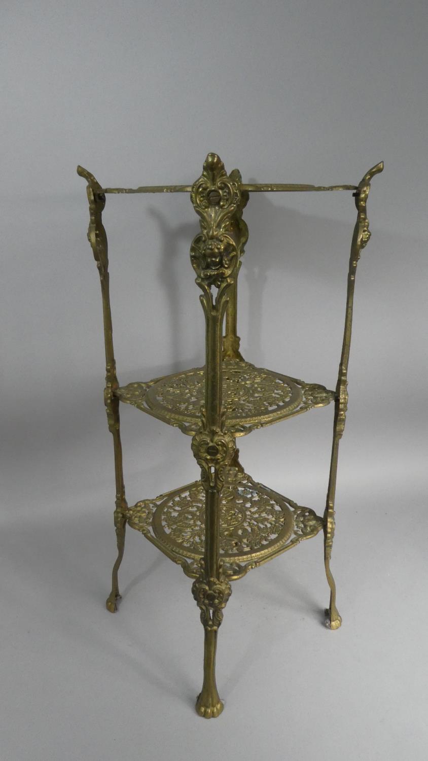 A Mid/Late 20th Century Brass Three Tier Stand with Pierced Shelves, 65cm High